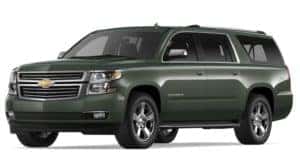 Green 2019 Chevy Suburban on white