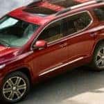 angled view of red 2019 GMC Acadia parked in driveway