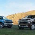 Two, 2020 Chevrolet Silverado 2500HD models parked on the grass