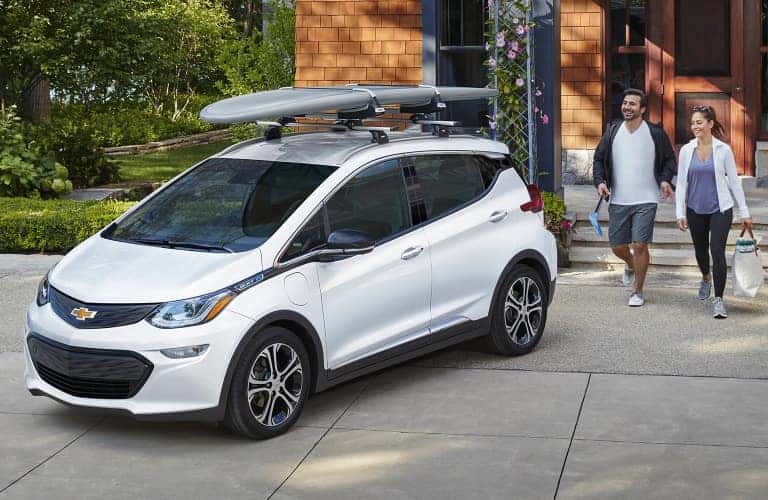 Husband and wife heading out on an adventure with their 2020 Chevrolet Bolt EV