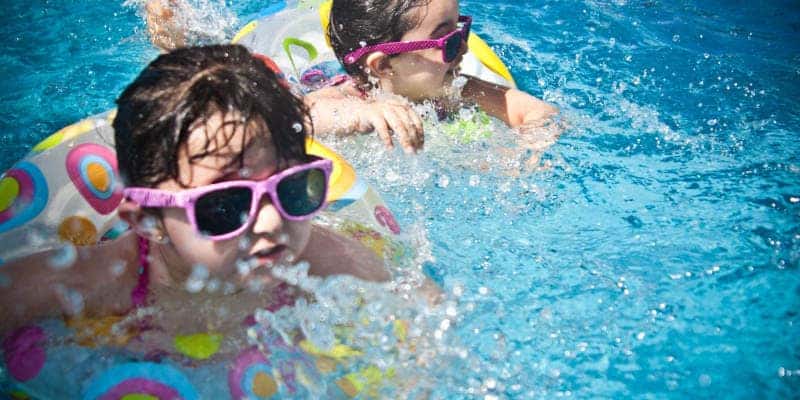 Kids swimming at one of the top three staycation spots near Kennesaw, GA.