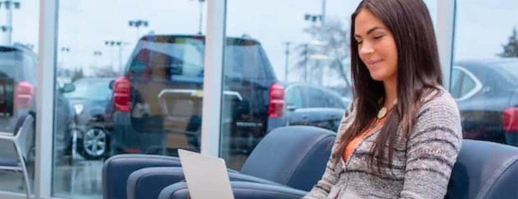A woman financing a car at a dealership near Kennesaw, GA.