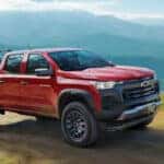 A side view of the 2024 Chevy Colorado demonstrating its off-road capabilities.