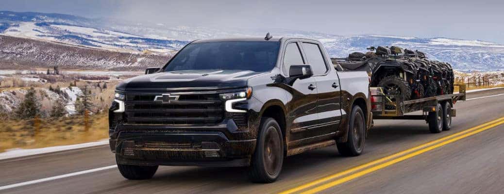 The 2024 Chevy Silverado 1500 towing a trailer.