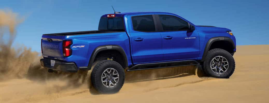 The 2025 Chevy Colorado off-roading in sand dunes.