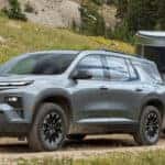 The 2025 Chevy Traverse towing a camper trailer.