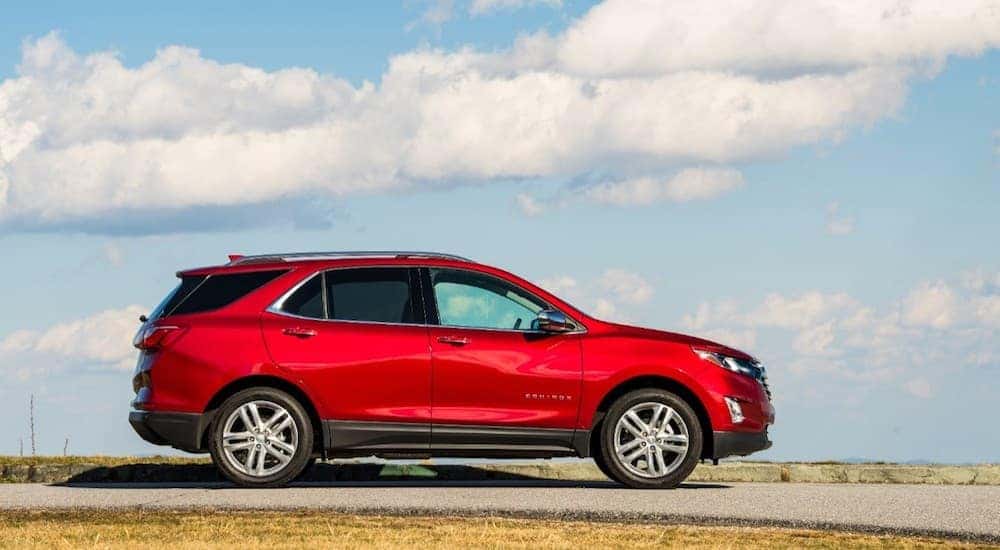 Red 2019 Chevy Equinox against clouded sky