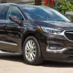 Grey 2019 Buick Enclave parked in front of gas station near Orlando FL
