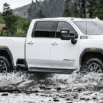 White 2020 GMC Sierra 2500HD AT4 driving through water