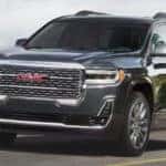 2020 GMC Acadia Denali swings its girth up a high-elevation road.