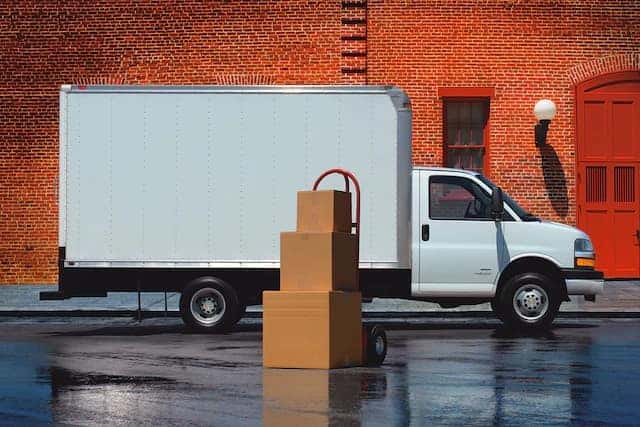 Side view of a 2020 Express Cutaway Van fitted with a large box.