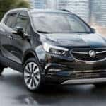 Black 2020 Buick Encore parked in a city.