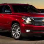 Red 2020 Chevy Tahoe looms before a sunset