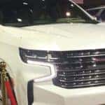 White 2020 Chevy Suburban at the Chicago Auto Show, on a red carpet display celebrating its Hollywood star award