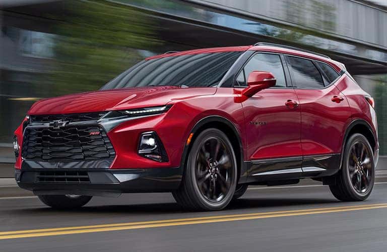 Red 2020 Chevy Blazer drives up a highway.