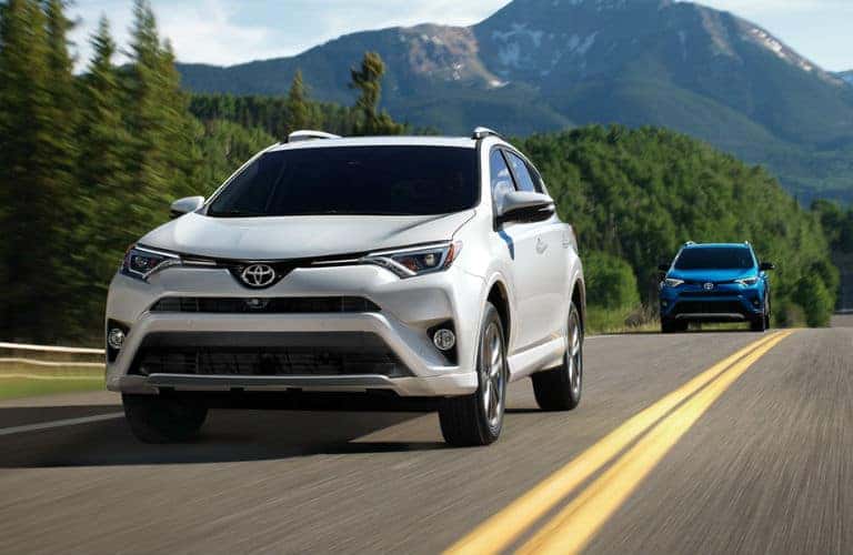White 2018 Toyota RAV4 rolls along a highway