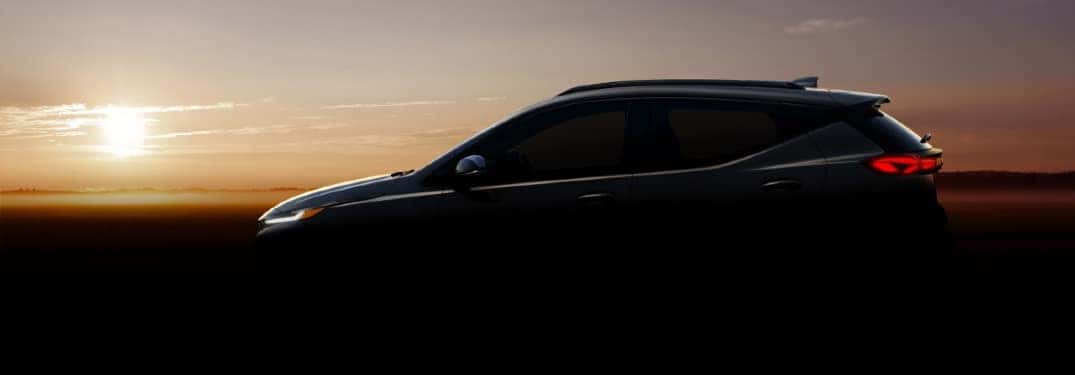 Silhouette of Chevy Bolt EUV against a sunrise