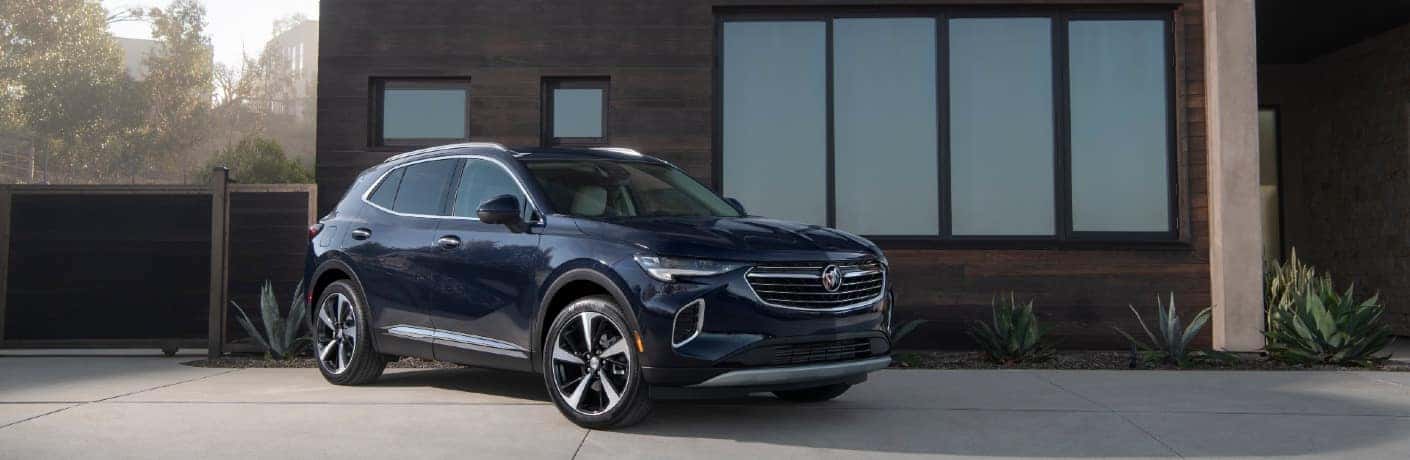 2021 Buick Envision in front of a futuristic house