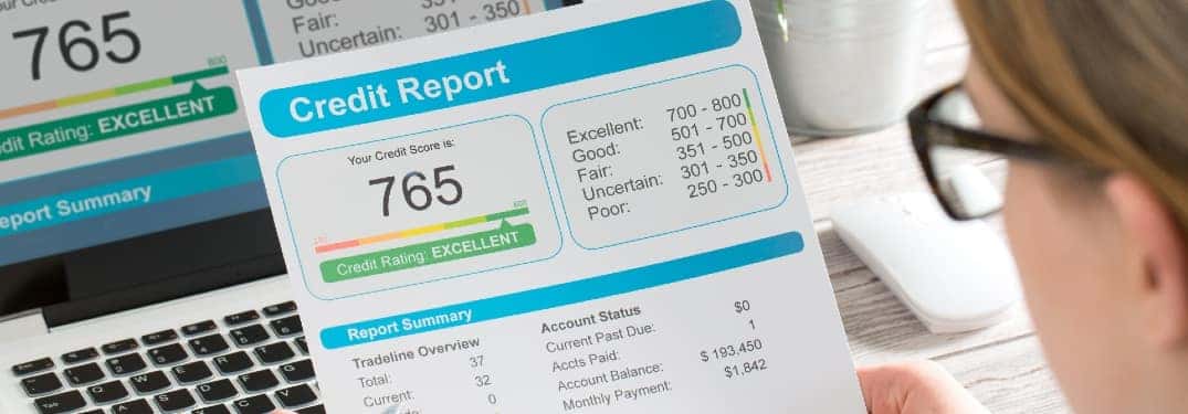 Woman looks at a credit score