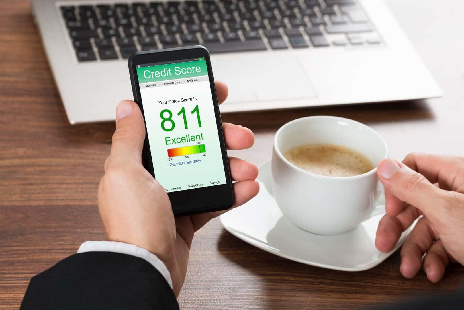 Man checks his credit score on his phone