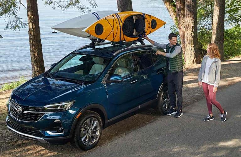 Man shows off how he put kayaks on top of his 2021 Buick Encore