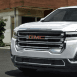 2022 GMC Acadia parked in front of a building