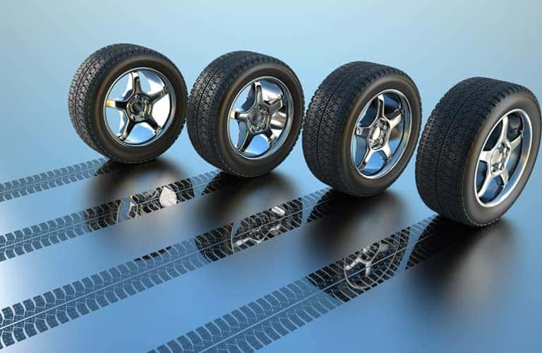 four tires on a blue surface