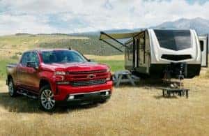 2022 Chevy Silverado 1500 LTD parked next to an RV
