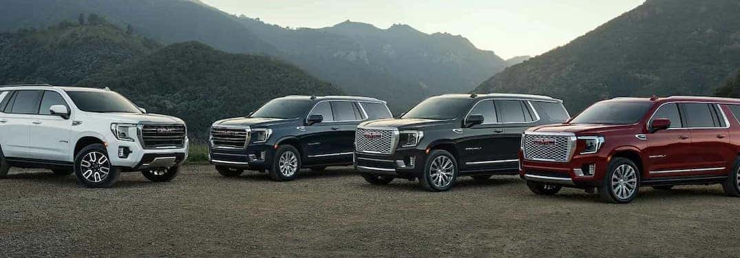 4 2022 GMC Yukon parked next to each other
