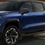 2024 Chevrolet Silverado EV plugged in to a wall charger