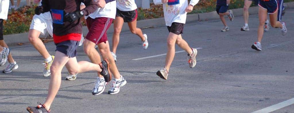 feet running on a road