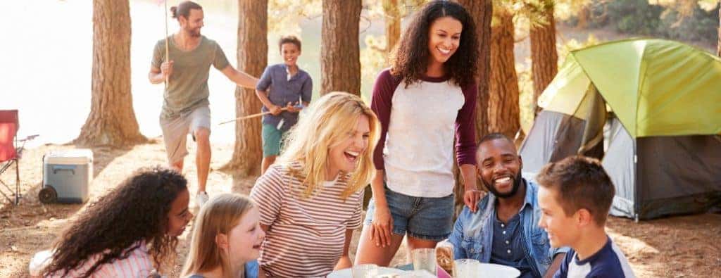 people hanging out at a campsite