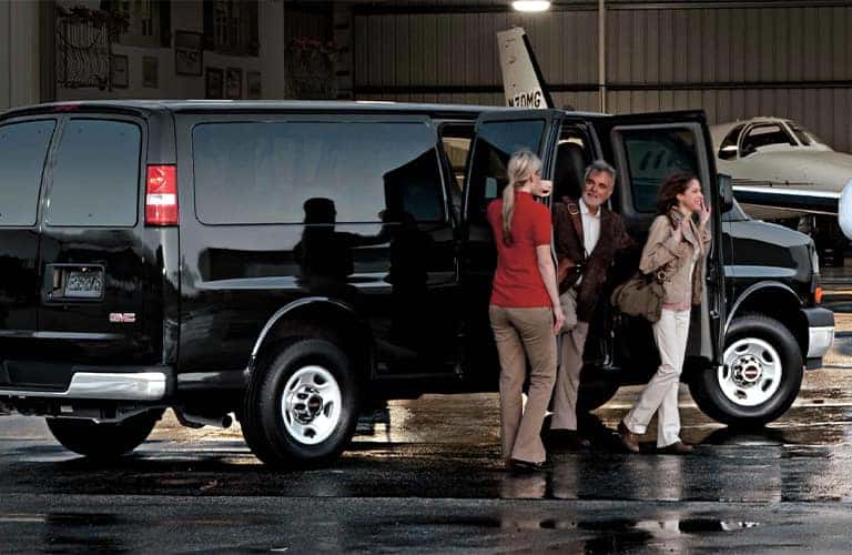 2023 GMC Savana Passenger van with some people