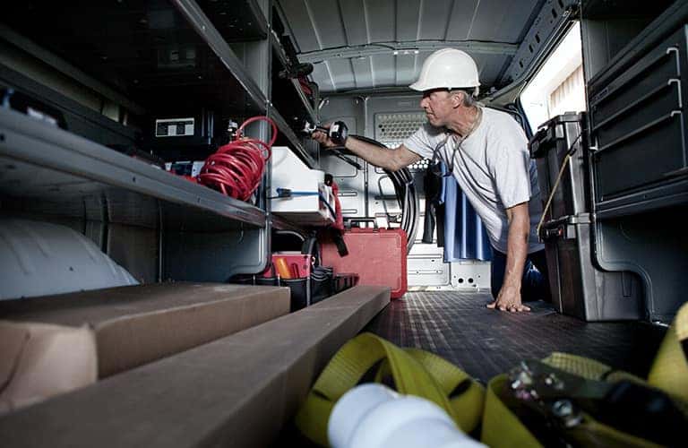2023 GMC commercial truck with a man inside