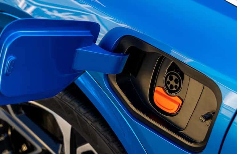 a blue 2023 Chevrolet Equinox charging port