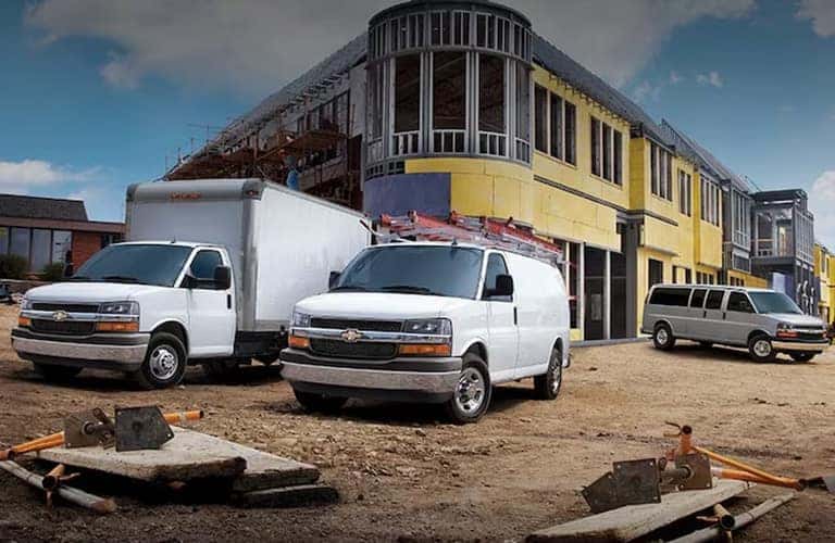 2023 Chevrolet Express vans at a work site