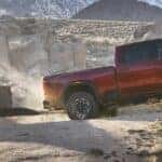 2024 GMC Sierra HD AT4X truck side view towing a trailer