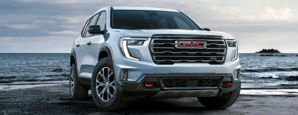 2024 GMC Acadia AT4 front view on a beach