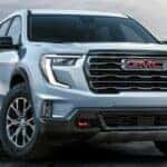 2024 GMC Acadia AT4 front view on a beach