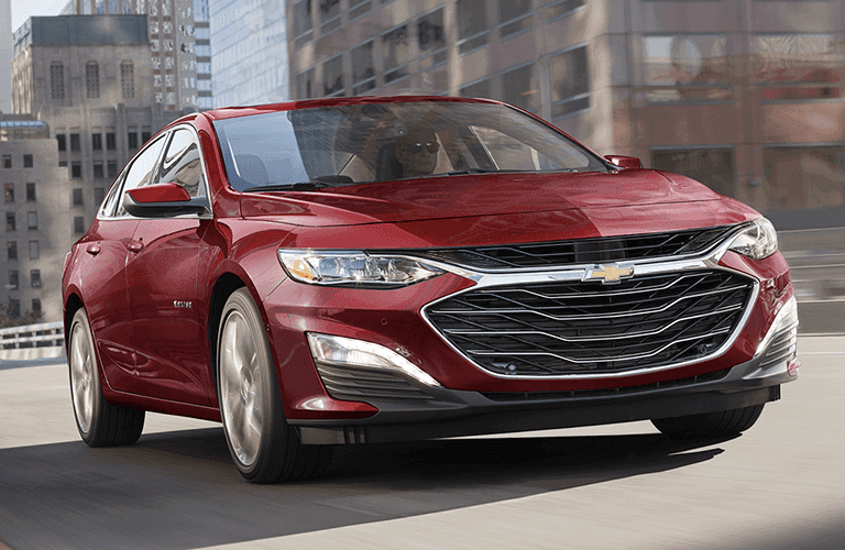 2023 Chevrolet red sedan in a city