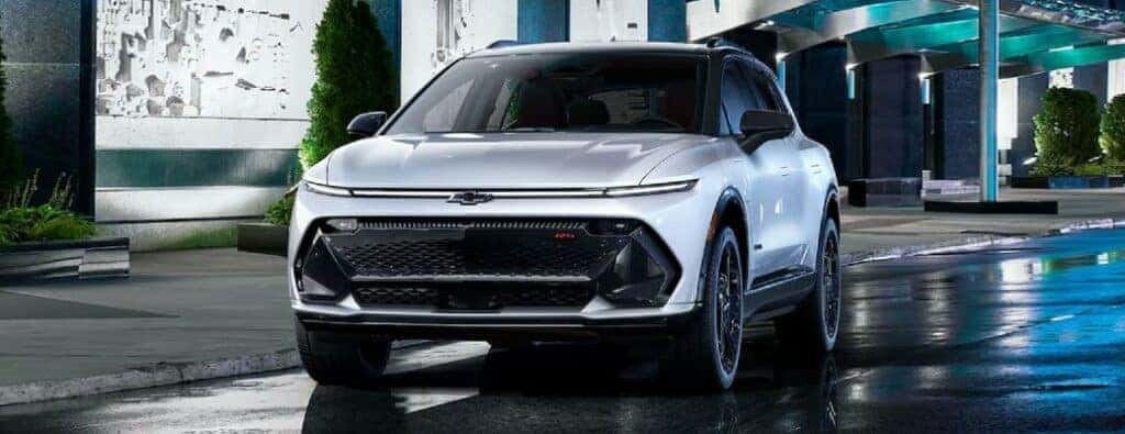 2024 Chevrolet Equinox front view parked on a wet road at night
