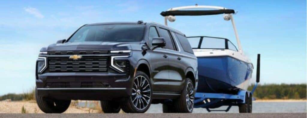 2025 Chevrolet Suburban towing a boat