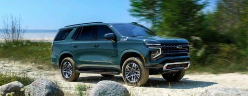 2025 Chevrolet Tahoe side view parked on a beach