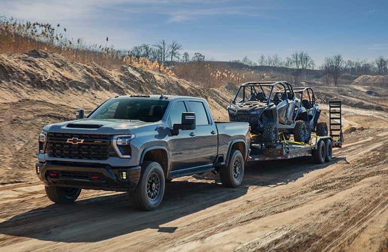2024 Chevrolet Silverado HD ZR2 exterior towing on a dirt road