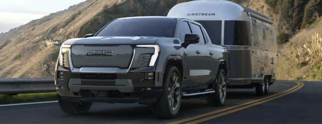 2024 GMC Sierra EV Denali towing a trailer