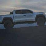 2024 Chevrolet Colorado truck side view on an incline at night