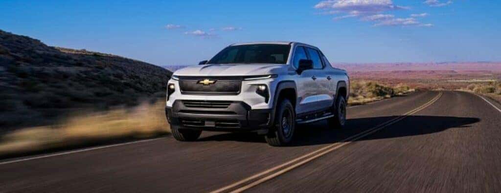 2024 Chevrolet Silverado EV WT front view on a road