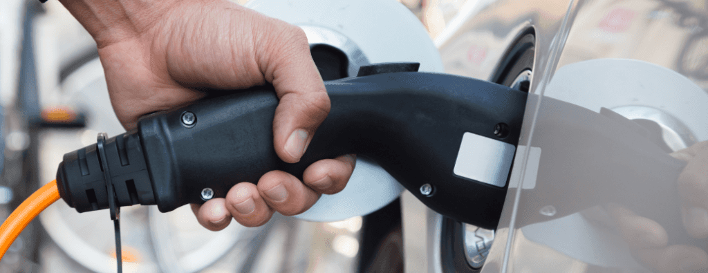 EV charger held in a person's hand
