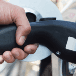 EV charger held in a person's hand