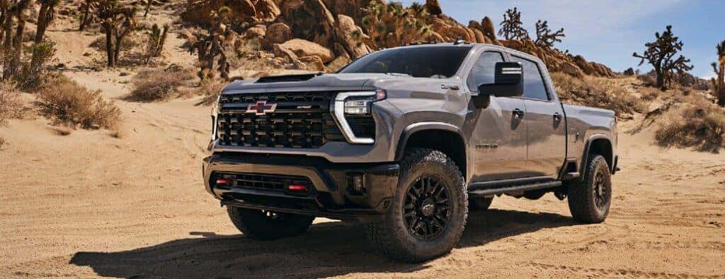 2024 Chevrolet Silverado HD ZR2 front and side view on sand